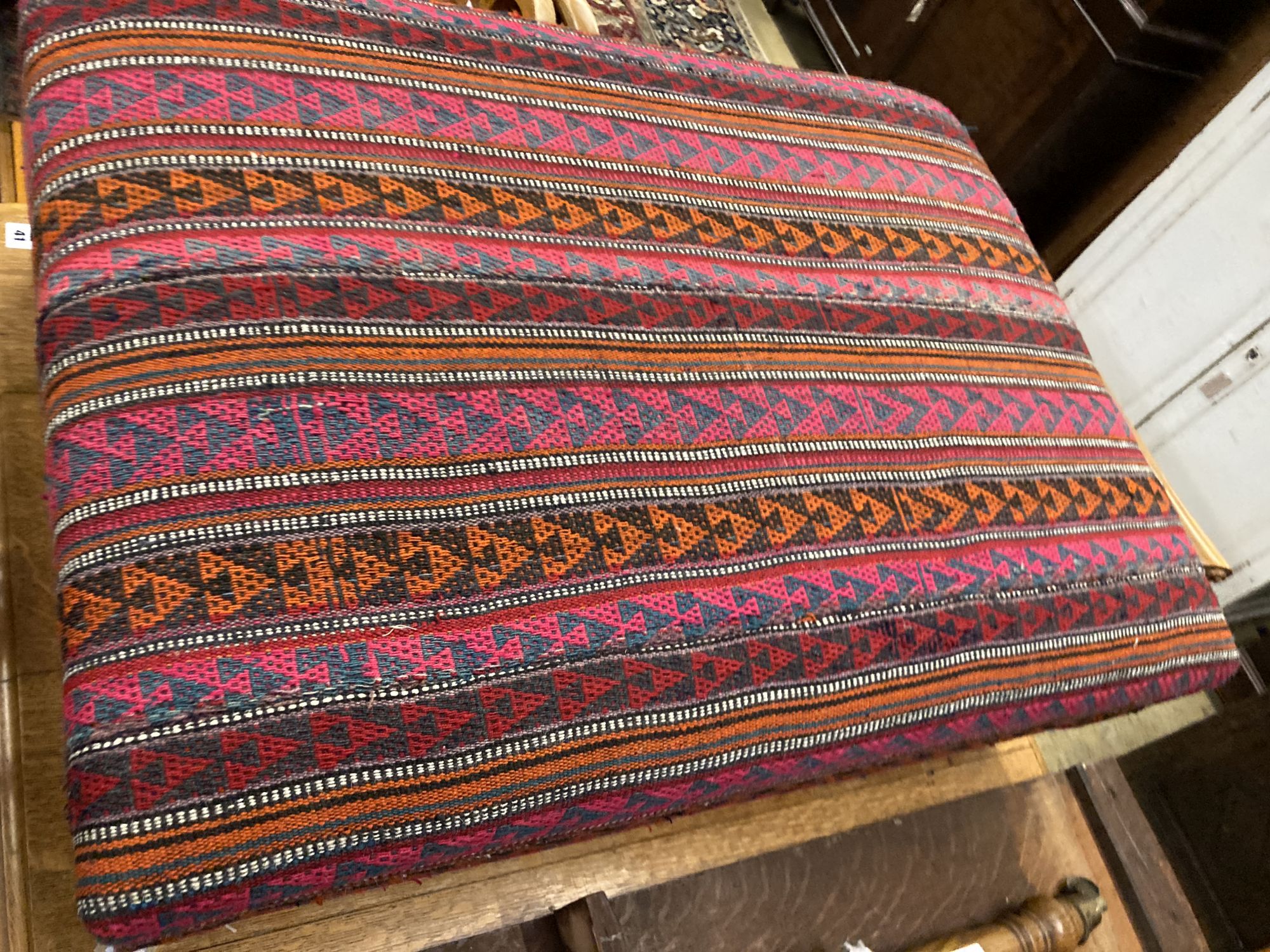 A Victorian style rectangular Kelim covered stool, width 98cm, depth 74cm, height 32cm